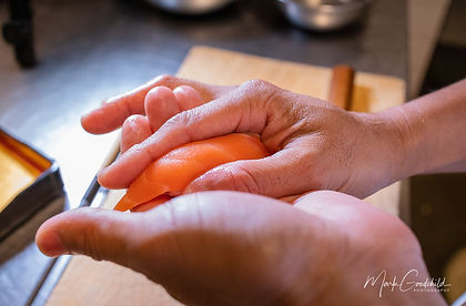 Makoto shaping nigiri by hand
